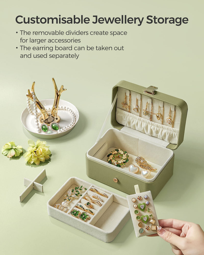 Open laurel green case beside a ring dish, showing removable dividers and the detachable earring board