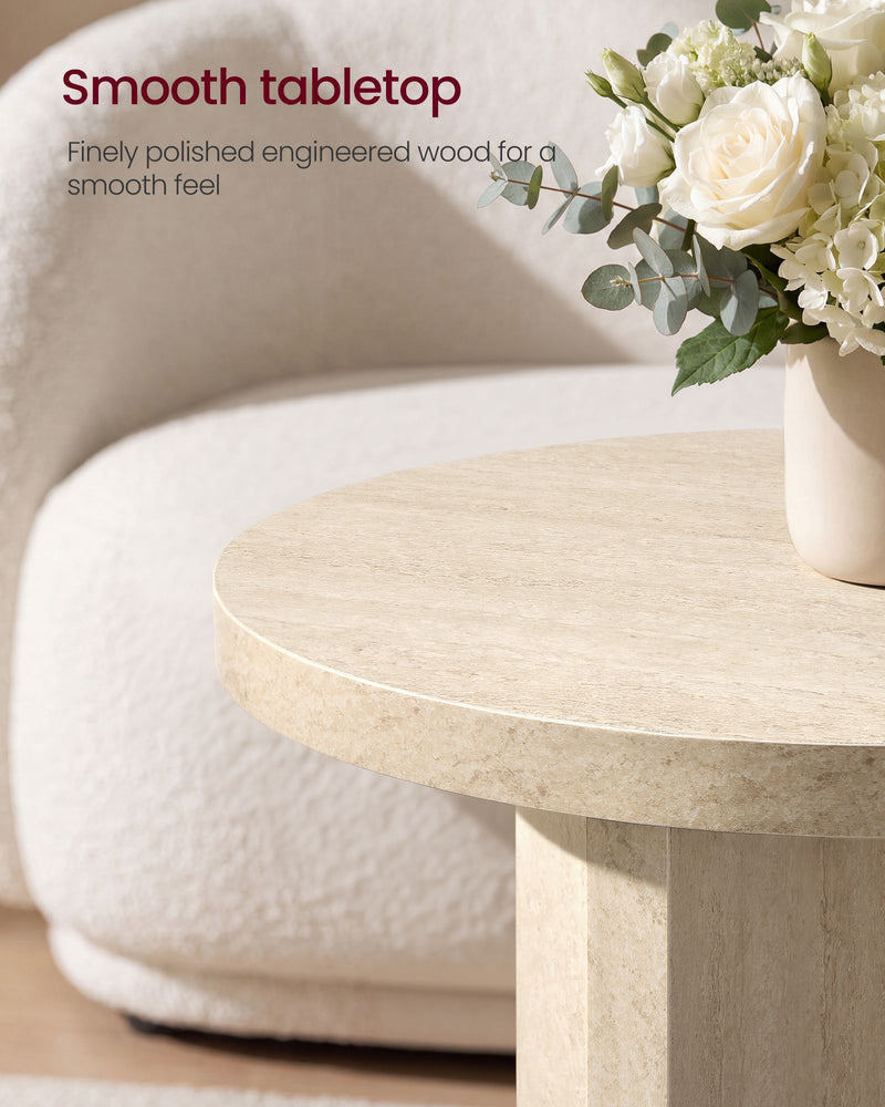 Close-up of the smooth round engineered wood tabletop with a vase of white flowers