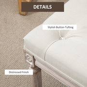 Close-up of the button tufting and distressed finish on the bench corner