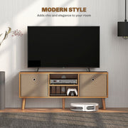 Brown TV cabinet with a TV on top and a media player and games controller on the open shelves