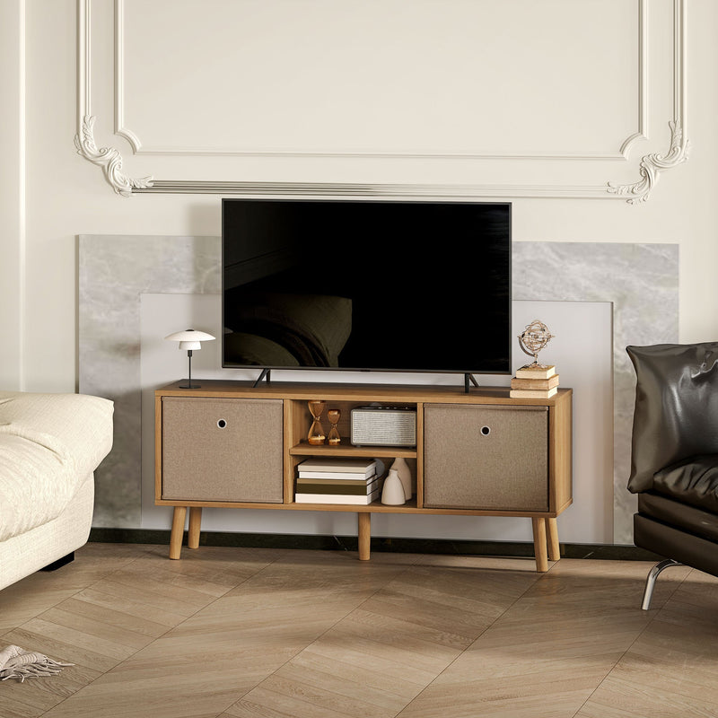 Brown TV stand in a panelled living room between a cream sofa and a leather armchair