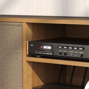Close-up of the wood-effect shelf with a stereo receiver next to a fabric drawer