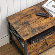 Close-up of the rustic brown wood-effect top surface with a remote control and stacked books