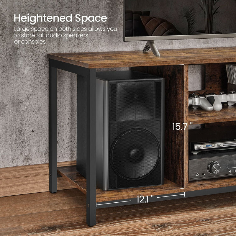 Side compartment of the TV stand holding a tall floorstanding speaker and media boxes