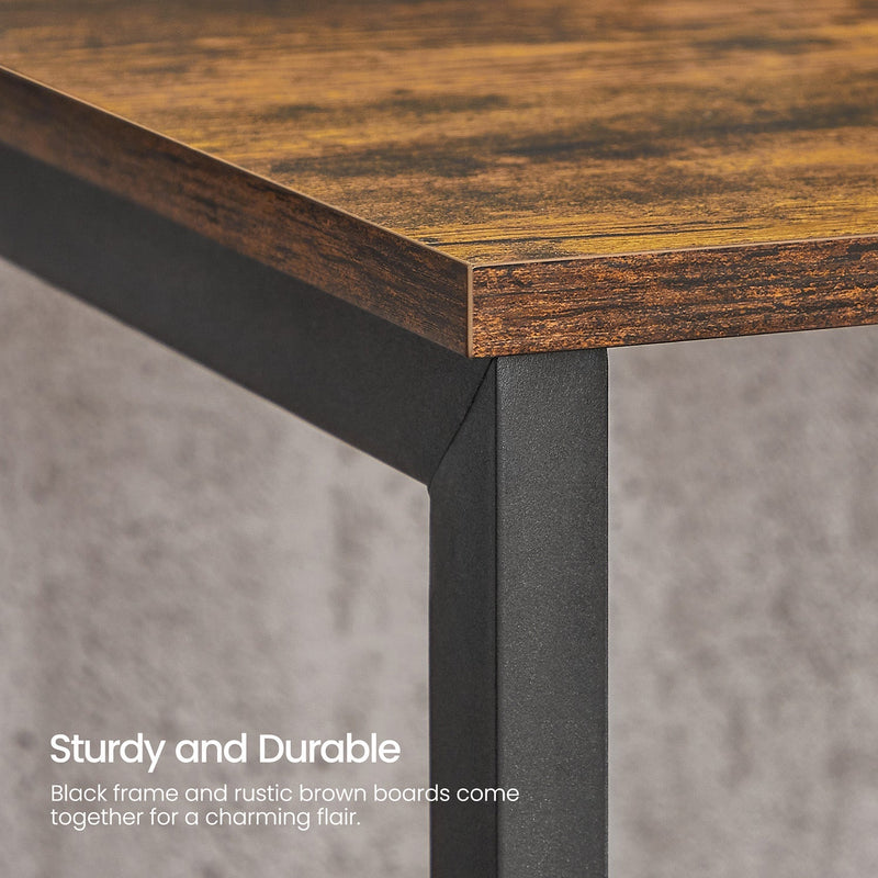 Close-up of the rustic brown tabletop edge meeting a black steel leg