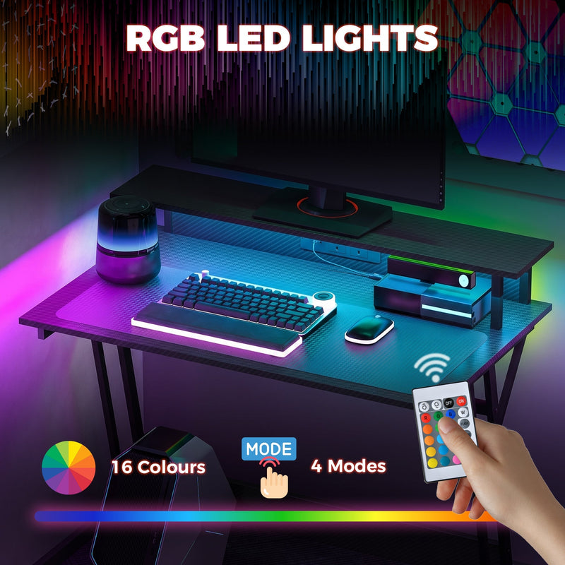 RGB LED panel showing 16 colours and 4 modes with the remote control held in a hand
