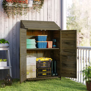 Green wooden shed with doors open against white cladding, filled with hose reels and tubs