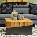 Two-tone bamboo and black square coffee table styled in front of a sofa