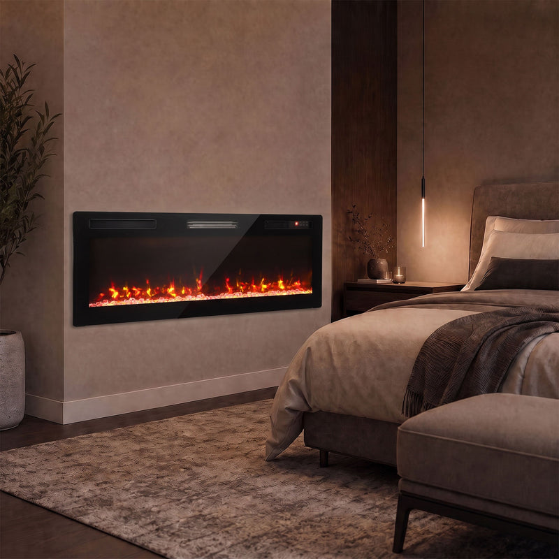 Electric fire on a bedroom wall beside a bed in warm lighting