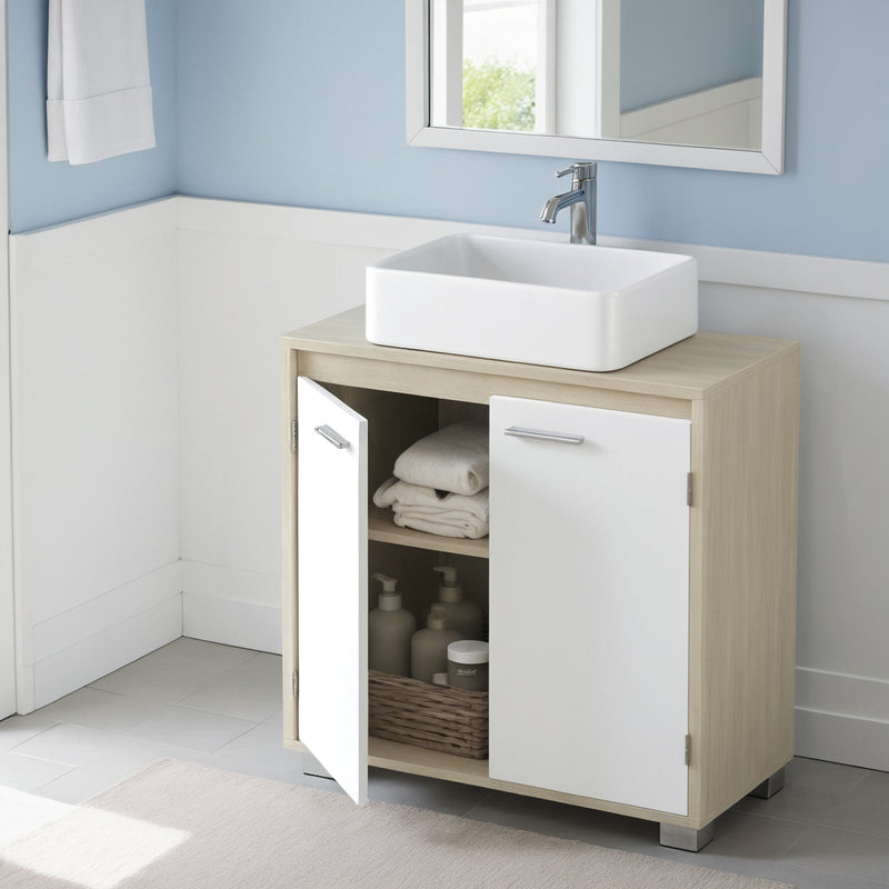 The cabinet in a blue and white panelled bathroom with a hanging towel and stacked towels on the shelf