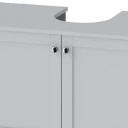 Close-up of the silver-tone round handles and cut-out on the light blue cabinet