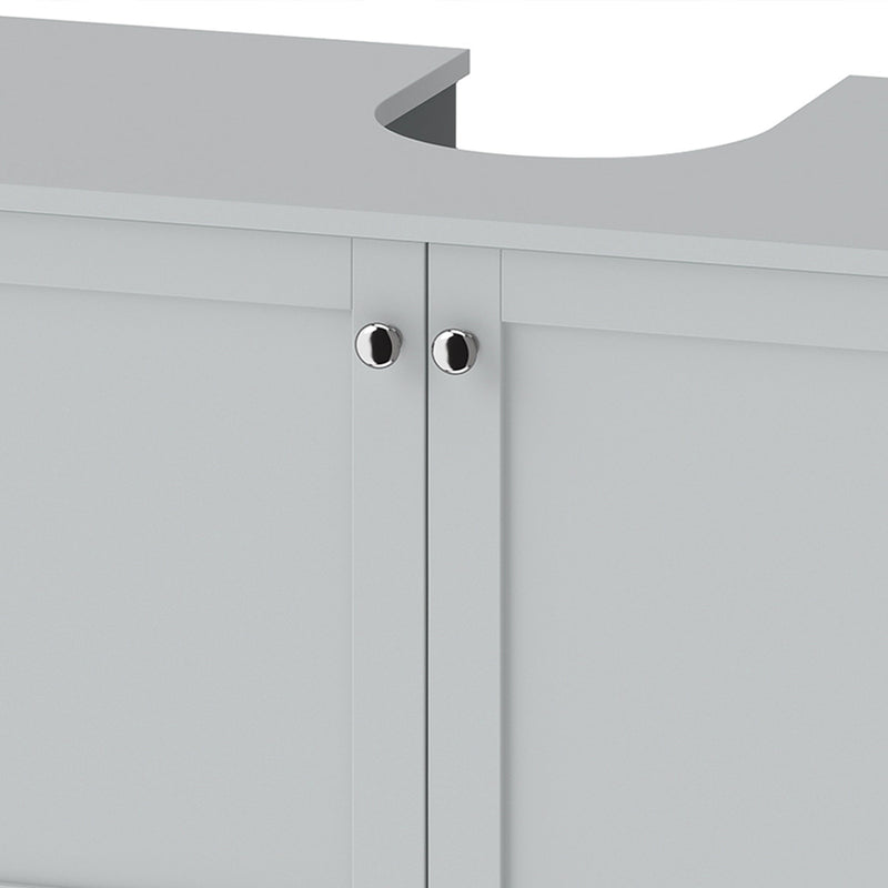 Close-up of the silver-tone round handles and cut-out on the light blue cabinet