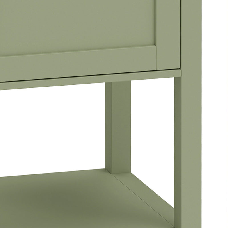 Close-up of the legs and open lower shelf of the green under sink cabinet