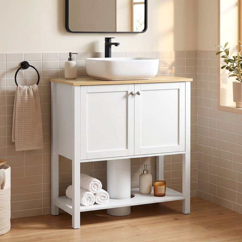 White under sink cabinet in a bathroom with a vessel sink, black tap and towel rail