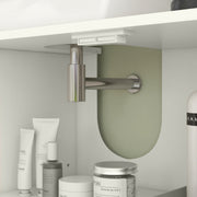 Inside the cream cabinet with the sink trap pipe passing through the cut-out