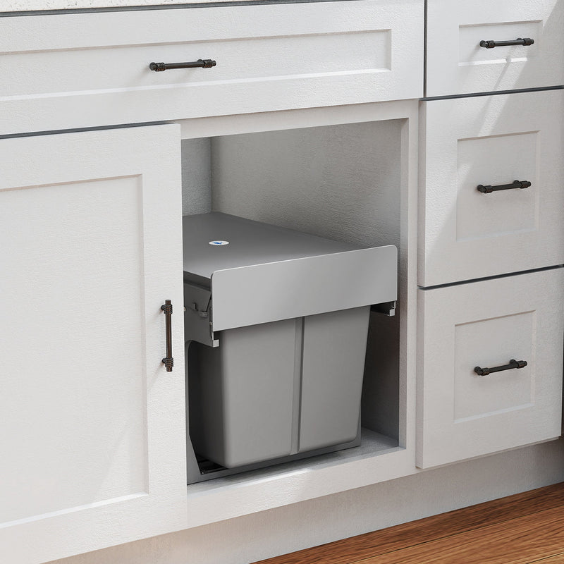 Pull-out bin fitted inside a white kitchen cabinet below the worktop