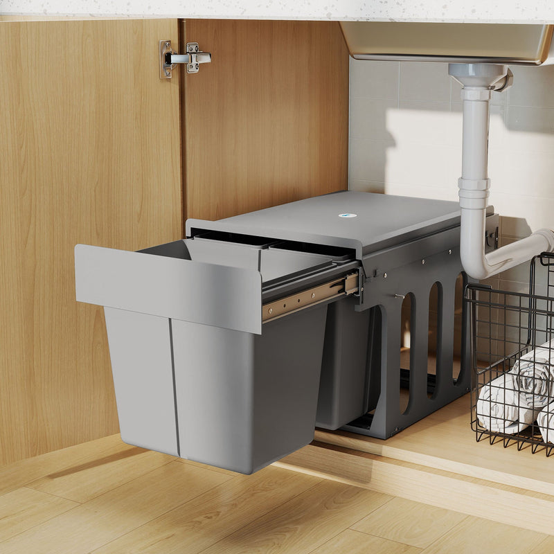 Close-up of pull-out bin partially pulled out from a wood-effect cabinet under the sink