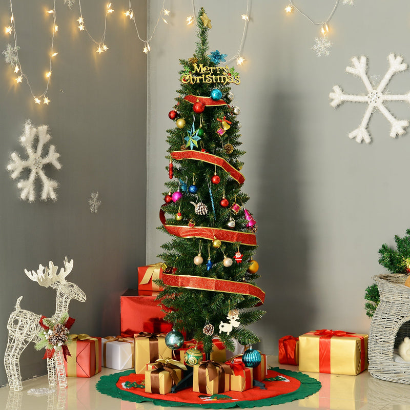Green pencil Christmas tree decorated with ribbon and baubles in a grey living room corner