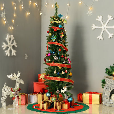 Green pencil Christmas tree decorated with ribbon and baubles in a grey living room corner