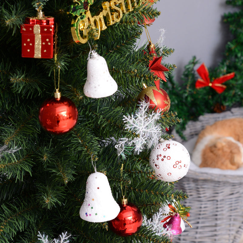 Close-up of green branches hung with red and white baubles and bells