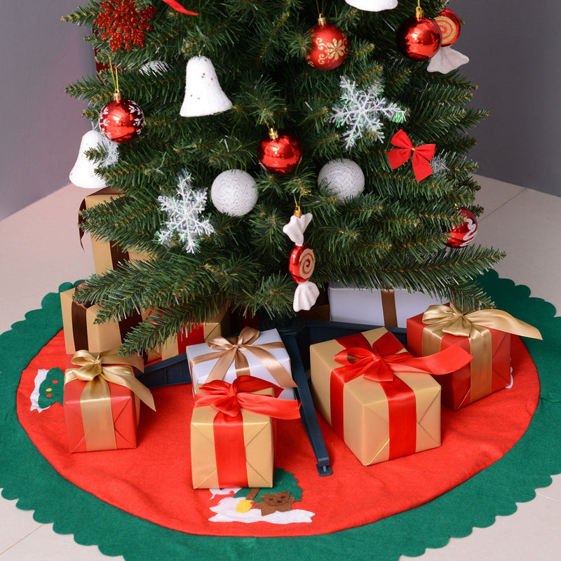 Lower half of the tree with baubles above gifts on a red tree skirt