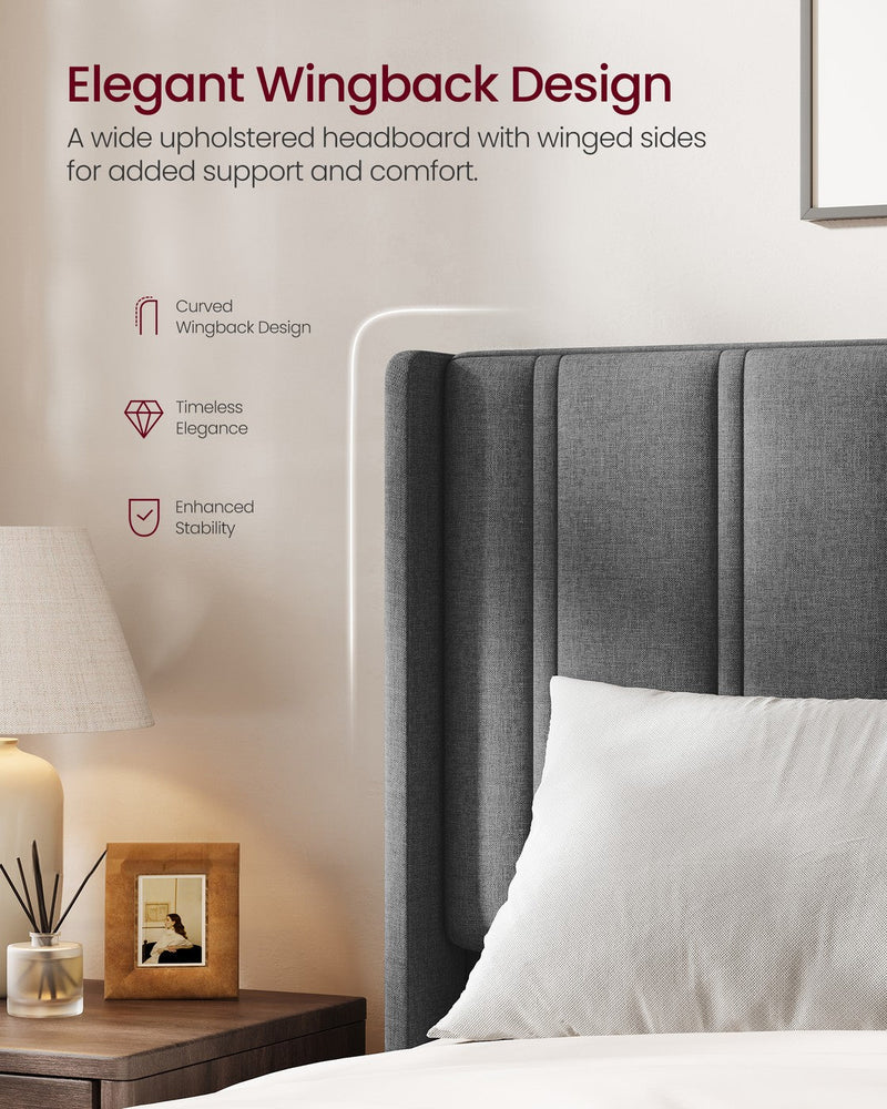 Close-up of the slate grey wingback headboard with its curved padded side wing