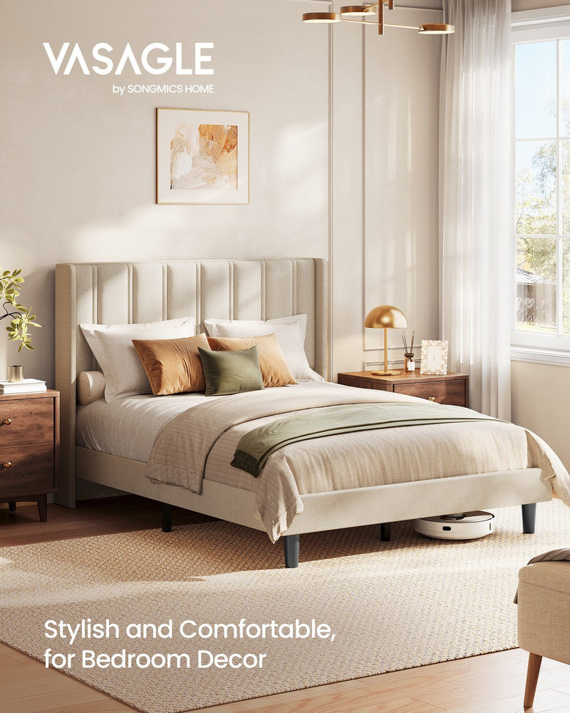 Cappuccino wingback double bed in a bright bedroom with a robot vacuum passing beneath it