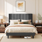 Slate grey wingback double bed made up with cream and olive bedding between two bedside tables