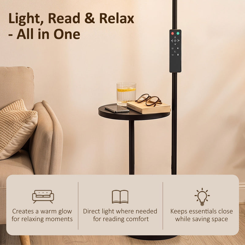 Floor lamp side table holding a book, glasses and drink beside a sofa