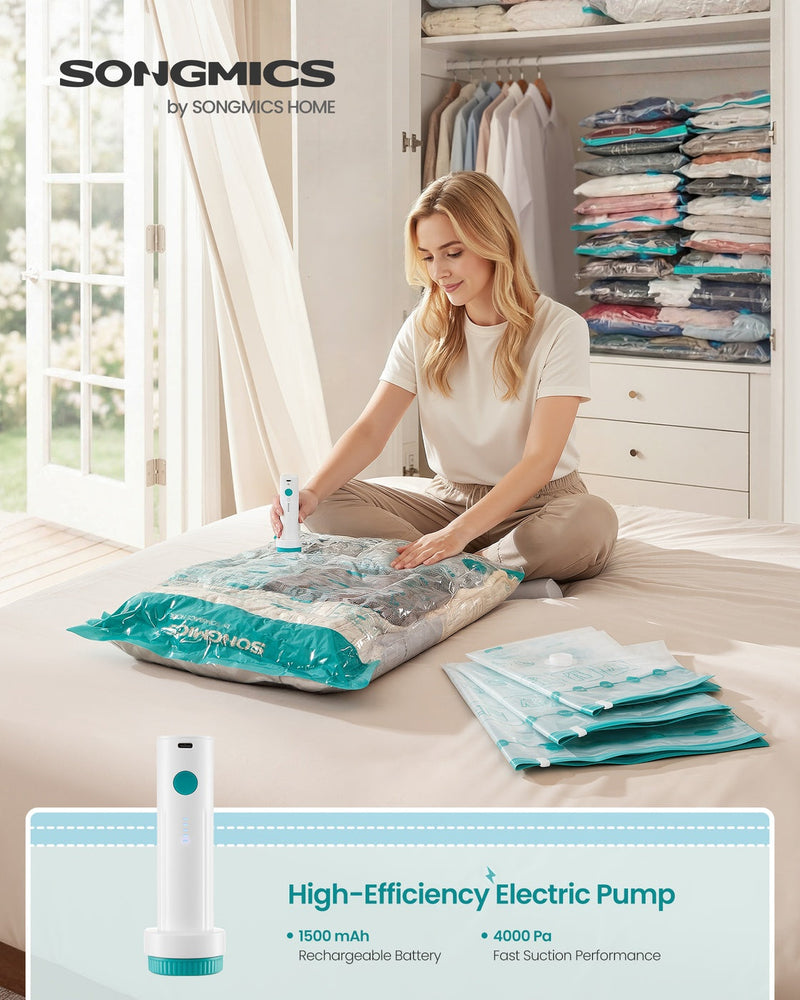 Woman using the Songmics electric pump to vacuum-seal a storage bag on a bed with a wardrobe of sealed bags behind