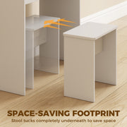 White stool tucked completely underneath the vanity desk to save floor space