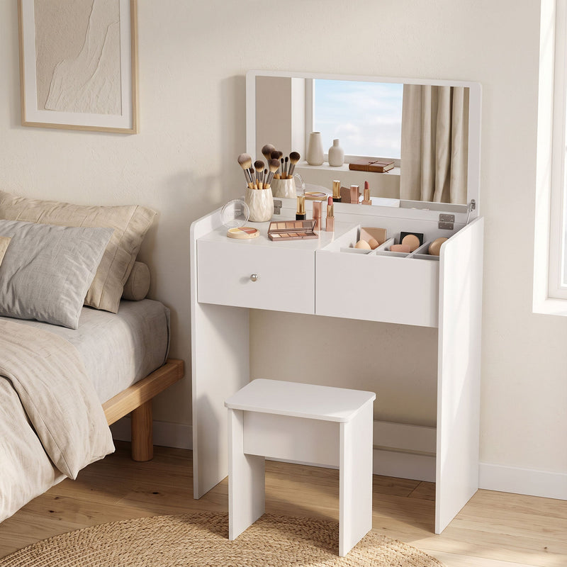 White vanity desk with makeup brushes and stool beside a bed