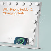 Phone charging on the built-in holder at the base of the vanity mirror