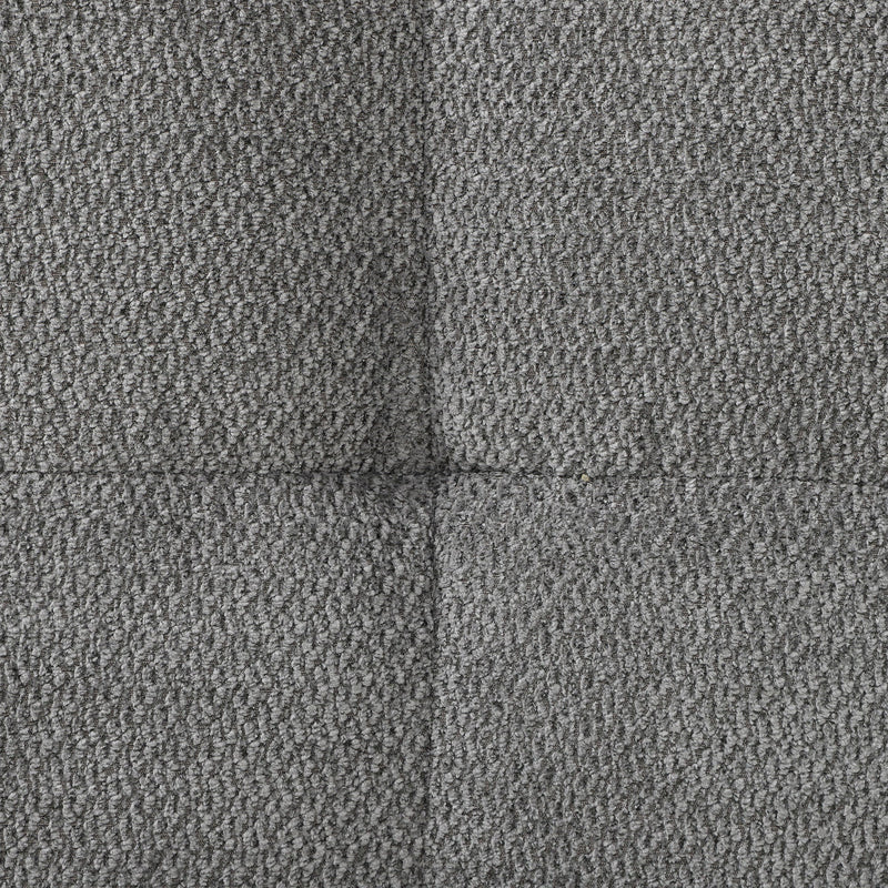 Close-up of grey textured velvet fabric and the seam between cushions
