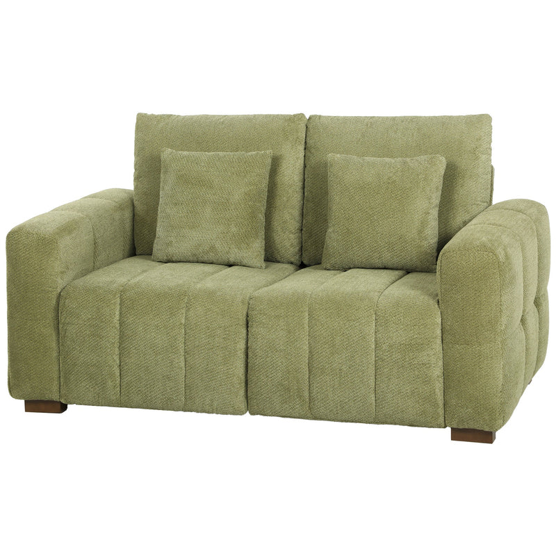 Green velvet 2 seater sofa with two pillows and wooden legs, front view on white