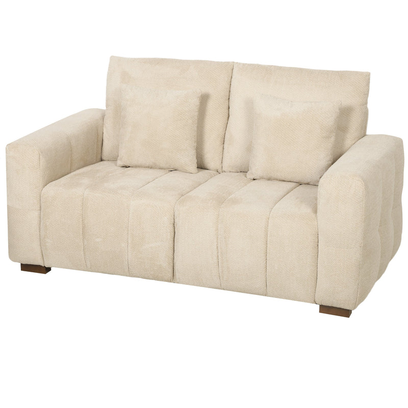 Cream white velvet 2 seater sofa with two pillows and wooden legs, front view on white