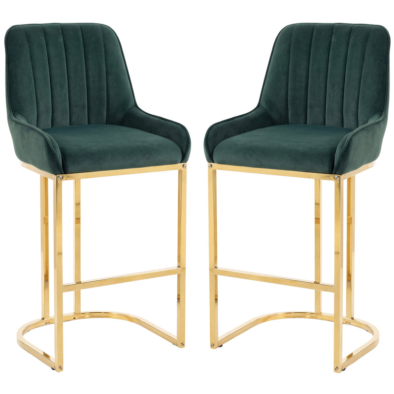 Set of 2 dark green velvet bar stools with gold legs on a white background