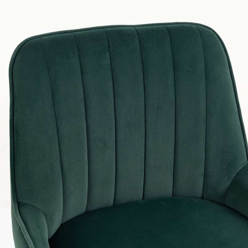 Close-up of the pleated dark green velvet backrest and seat cushion