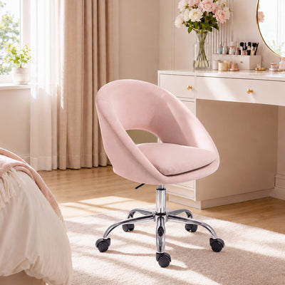 Pink velvet desk chair shown from the back, showing the rounded barrel-style backrest