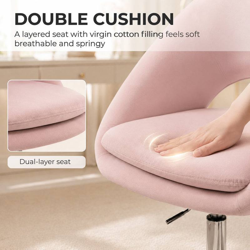 Pink velvet desk chair in a home study setting beside a desk