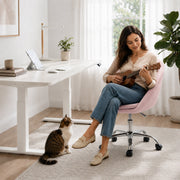 Pink velvet desk chair shown at a raised seat height setting