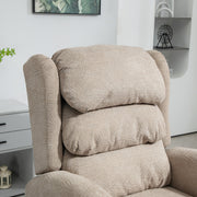 Close-up of the padded wingback headrest and armrest