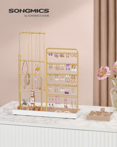 Angled view showing necklaces hanging on the stand