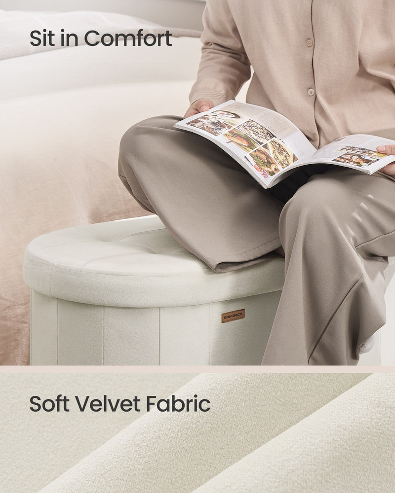 Person sitting on the velvet storage ottoman bench reading a magazine, close-up of the soft velvet fabric