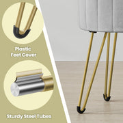 Close-up of the gold steel legs and black plastic foot covers