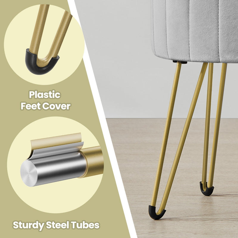 Close-up of the gold steel legs and black plastic foot covers