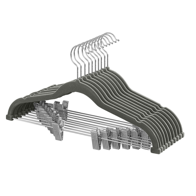 Set of 10 grey velvet trouser hangers stacked with adjustable clips visible