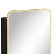 Close-up of the rounded natural wood mirror frame and black cabinet side