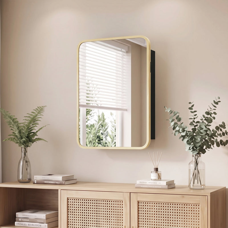 Natural wood frame mirror cabinet hung above a rattan sideboard with plants