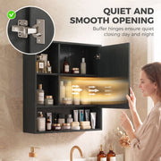 Close-up of the buffer hinge beside a woman closing the open black mirror cabinet door
